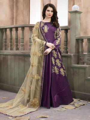 Grab This Designer Floor Length Suit In Purple Color Paired With purple Colored Bottom And Beige Colored Dupatta. Its Top Is Fabricated On Art Silk Paired With Santoon Bottom And Net Dupatta. Its Top And Dupatta Are Beautified With Jari Embroidery And Stone Work. It Is Light Weight And Easy To Carry All Day Long.