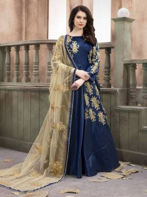 Enhance Your Personality Wearing This Dark Shade In Blue Paired With Dark Blue Colored Bottom And Beige Colored Dupatta. Its Top Is Fabricated On Art Silk Paired With Santoon Bottom And Net Dupatta. Its Has Attractive Embroidery Over The Top And Dupatta. Buy This Designer Floor Length Suit Now.