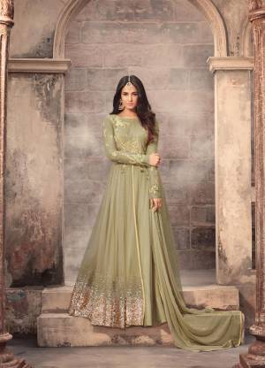 New And Unique Shade In Green Is Here With This Lovely Mint Green Colored Designer Floor Length Suit Paired With Mint Green Colored Bottom And Dupatta. Its Is Beautified With Heavy Embroidery Over The Yoke And The Panel. Buy It Now.