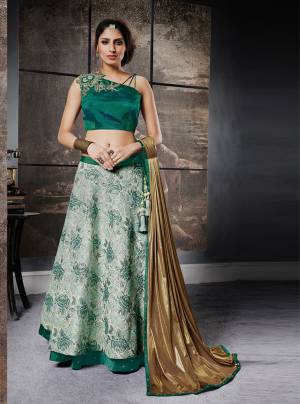 Get Ready For The Upcoming Wedding Season With this Pretty Designer Lehenga Choli In Pine Green Colored Blouse Paired With Green And White Lehenga And Golden Colored Dupatta. Its Top Is Fabricated On Art Silk Paired With Jacquard Silk Lehenga And Lycra Dupatta. All Fabircs Are Comfortable To Wear And Carry Throughout The Gala.