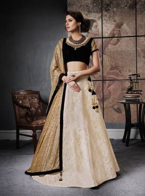 Enhance Your Pesonality Wearing This Rich And Elegant Looking Lehenga Choli In Black Colored Blouse Paired With Cream Lehenga And Golden Colored Dupatta. This Trendy Lehenga Choli Suits Every Personality. Buy This Now Before The Stock Ends.