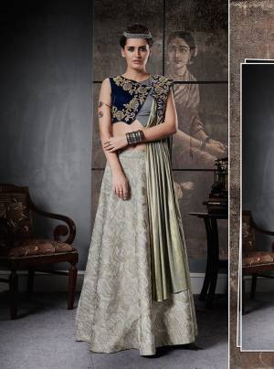 Add this Designer Lehenga Choli To Your Wardrobe In Navy Blue Colored Blouse Paired With Grey Colored Lehenga And Dupatta. Its Blouse Is Fabricated On Velvet And Art Silk Paired With Jacquard Silk Lehenga And Net Dupatta.  Buy This Now.