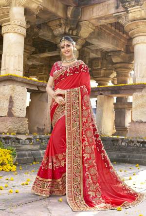 Adonr The Angelic Look Wearing This Saree In Red Color Paired With Red Colored Blouse. This Saree Is Fabricated On Georgette Paired With Art Silk Fabricated Blouse. It Is Beautified With Attractive Embroidered Lace Border. Buy This Designer Saree Now.