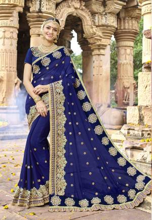 Enhance Your Personality Wearing This Saree In Navy Blue Color Paired With Navy Blue Colored Blouse. This Saree Is Fabricated On Georgette Paired With Art Silk Fabricated Blouse. Its Lovely Color And Attractive Designs Will Earn You Lots Of Compliments From Onlookers.