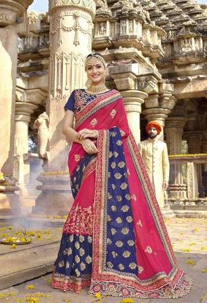 This Wedding Season, Earn Lots Of Compliments Wearing This Attractive Designer Saree In Dark Pink And Navy Blue Color Paired With Navy Blue Colored Blouse. This Saree Is Fabricated On Georgette Paired With Art Silk Fabricated Blouse. Its Fabrics Ensures Superb Comfort Which Is Easy To Carry Throughout The Gala.