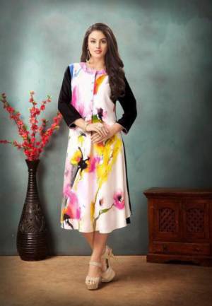 Simple And Elegant Looking Readymade Kurti Is Here In White And Multi Color Fabricated On Rayon Cotton Beautified With Colorful Prints. Its Is Soft Towards Skin And Easy To Carry All Day Long.