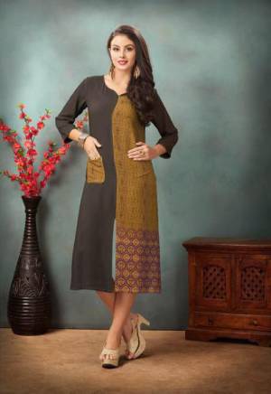 Enahnce Your Personality Wearing This Elegant Looking Kurti In Dark Grey Color Fabricated On Rayon Cotton. This Kurti Is Beautified With Prints And Also Light In Weight. Buy This Readymade Kurti Now.