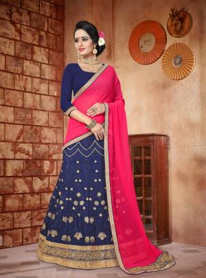 Dark Colors Always Gives And Attractive Look To Your Personality, So Grab This Lehenga Choli In Navy Blue Color Paired Contrasting  Dark Pink Colored Dupatta. Its Blouse Is Fabricated On Art Silk Paired With Georgette Fabricated Lehenga And Dupatta. It Has Heavy Heavy Embroidery All Over The Lehenga. Buy It Now.