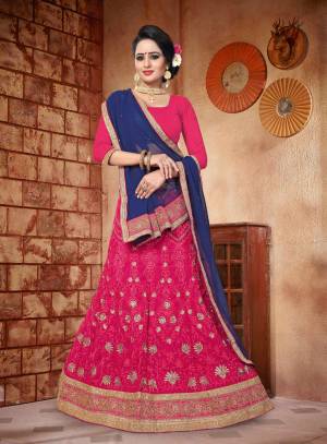 Shine Bright Wearing This Lehenga Choli In Dark Pink Color Paired With Navy Blue Colored Dupatta. Its Blouse Is Fabricated On Art Silk Paired With Georgette Fabricated Lehenga And Dupatta. Buy This Designer Heavy Lehenga Now.