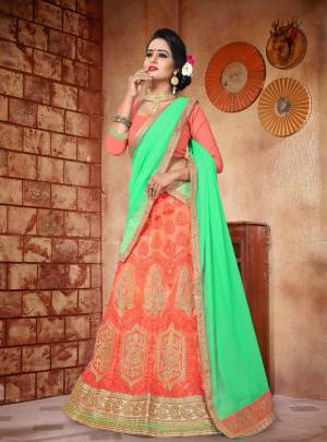 Shades Of Orange Induces Perfect Summery Appeal To Any Outfit, So Grab This Lehenga Choli In Light Orange Color Paired With Contrasting Sea Green Colored Dupatta. Its Blouse Is Fabricated On Art Silk Paired With Net Lehenga And Georgette Dupatta. Buy It Now.