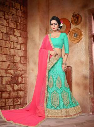 Celebrate This Festive Season And Wedding Season Wearing This Beautiful Lehenga Choli In Aqua Blue Color Paired With Contrasting Pink Colored Dupatta. Its Blouse Is Fabricated On Art Silk Paired With Net Lehenga And Georgette Dupatta. It Has Heavy Embroidery With Jsri And Resham Over The Lehenga. Buy Now.