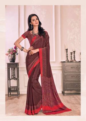 Add This Beautiful Color To Your Wardrobe In Wine Colored Saree Paired With Wine Colored Blouse. This Saree And Blouse Are fabricated On Crepe Which Is Soft Towards Skin And Easy To Carry All Day Long.