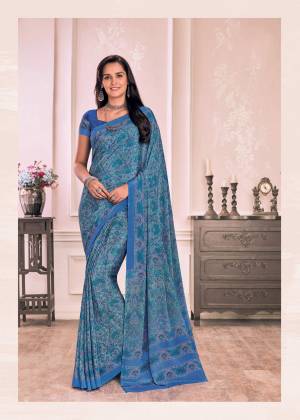 Grab This Saree In Blue Color Paired With Blue Colored Blouse. This Saree And Blouse Are Fabricated On Crepe Beautified With Intricate Prints All Over It. 