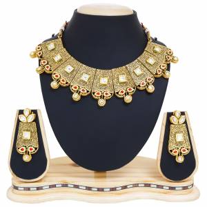 Heavy Queen Type Necklace Set Is Here In Golden Color Made On Mix Metal Beautified With Stone Work In Red And Beige. This Necklace Set Can Be Paired With Lehenga Choli Or Saree. Buy It Now.