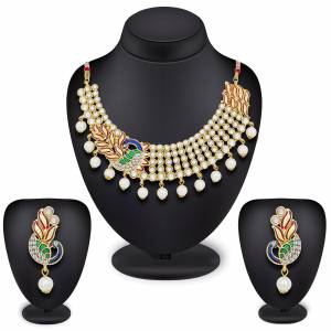 Add This Pretty Necklace Set With Pearls And Peacock Pattern. This Necklace Set Can Be Paired With Any Colored Traditonal Attire. Buy Now.