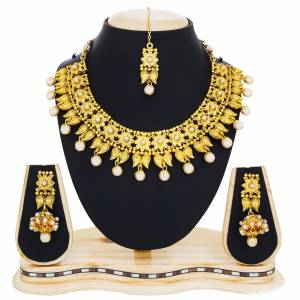 Beautifully Crafted Necklace Set Is Here In Golden Color Beautified With Stone Work And Holy Picture Craved Over It. This Traditonal Necklace set Will Earn You Lots Of Compliments From Onlooker