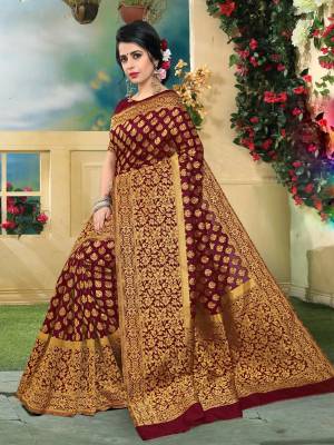 Adorn The Beautiful Queen Look Wearing This Saree In Maroon Color Paired With Maroon Colored Blouse. This Saree And Blouse Are Fabricated On Art Silk Beautified With Attractive Weave All Over It. Buy This Saree And Flaunt Your Royal Look.