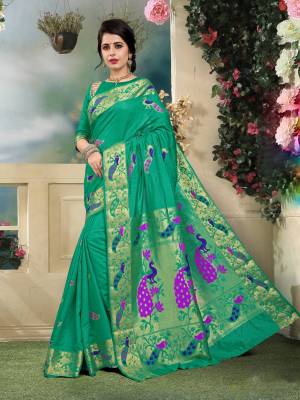 Look Pretty Wearing This Saree In Green Color Paired With Green Colored Blouse. This Saree And Blouse Are Fabricated On Art Silk. Its Color And Fabric Gives You A Rich Look Like Never Before.