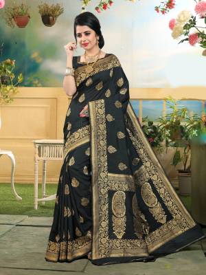Enhance Your Beauty Wearing This Saree In Black Color Paired With Black Colored Blouse. This Saree And Blouse Are Fabricated On Art Silk Beautified With Weave. It Is Light Weight And Earn You Lots Of Compliments From Onlookers.