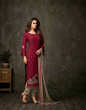 Adorn The Royal Look Wearing This Designer Staright Cut Suit In Maroon Colored Top Paired With Contrasting Grey Colored Bottom And Dupatta. Its Top Is Fabricated On Georgette Paired With Embroidred Santoon Bottom And Chiffon Dupatta. Buy This Designer Suit Now.