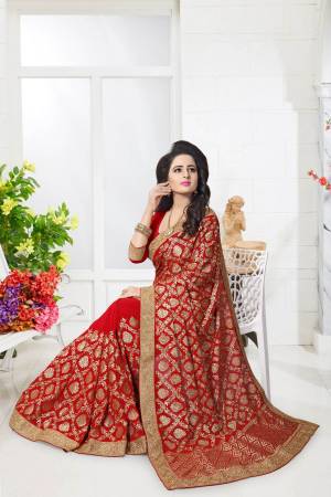 Here Is A Quite Heavy Saree In Red Paired With Red Colored Blouse. This Saree And Blouse Are Fabricated On Georgette. This Pretty Saree Is Beautified With Heavy Jari Embroidery With Stone Work All Over It.