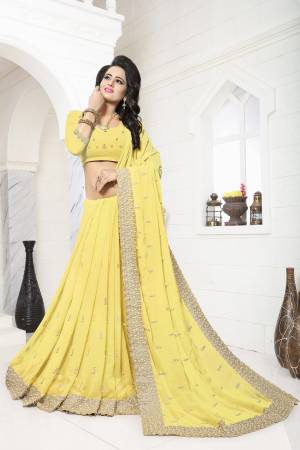 Celebrate This Festive Season Wearing This Saree In Yellow Color Paired With Yellow Colored Blouse. This Saree And Blouse Are Fabricated On Georgette Beautified With Heavy Moti Work All Over Its Lace Border And Scattered Over The Saree.