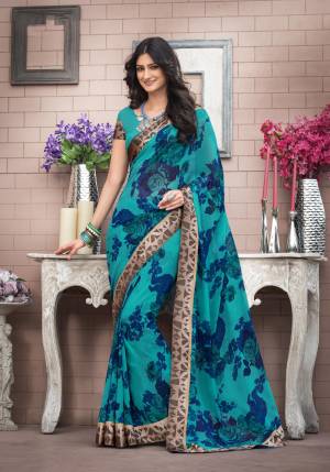 If Floral IS Your Choice Than Go For This Pretty Saree In Blue Color Paired With Blue Colored Blouse. This Saree Is Fabricated On Georgette Beautified With Bold Floral Prints Paired With Satin Fabricated Printed Blouse. Buy Now.