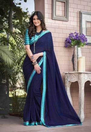 Enhance Your Personality Wearing This Saree In Dark Blue Color Paired With Blue Colored Blouse. This Saree Is Fabricated On Georgette Paired With Satin Fabricated Blouse. This Rich Looking Saree Will Earn You Lots Of Compliments From Onlookers.
