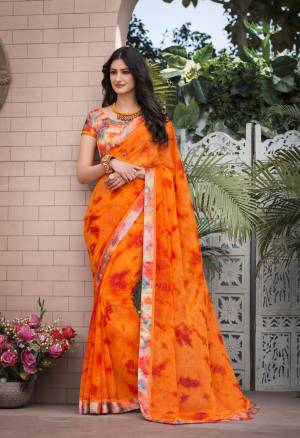 Shine Bright Wearing This Saree In Orange Color Paired With Multi Colored Blouse. This Saree Is Fabricated On Georgette Paired With Satin Fabricated Blouse. This Attractive Saree And Blouse Are Beautified With Prints. It Is Light Weight And Easy To Carry All Day Long.