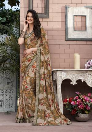 Combination Of Rich And Elegant Colors Is Here With This pretty Multi Colored Saree Paired With Grey Colored Blouse. This Saree Is Fabricated On Georgette Paired With Satin Fabricated Blouse. It Has Bold Prints Which Look More Attractive When You Drape It.