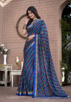 Geomteric Prints Are Here With This Beautiful Saree In Blue Color Paired With Blue Colored Blouse. This Saree Is Fabricated On Georgette Paired With Satin Fabricated Blouse. It IS Soft Towards Skin So It Is Easy To Carry All Day Long.