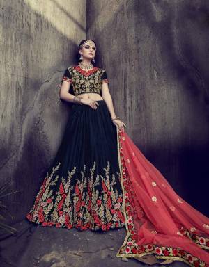 Get Ready For The Next Wedding Wearing This Designer Lehenga Choli In Navy Blue Color Paired With Contrasting Pink Colored Dupatta. Its Blouse And Lehenga Are Fabricated On Rich Velvet Paired With Net Fabricated Dupatta. It Has Contrasting Embroidery Which Will Give An Attractive Look To Your Whole Attire.