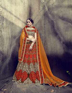 Go Colorful With This Attractive Designer Lehenga Choli In Multi Color Paired With Contrasting Orange Colored Dupatta. Its Blouse And Lehenga Are Fabricated On Velvet Paired With Net Dupatta. It Multi Colored Thread Embroidery Will Give You The Most Unique And Attractive Look. Buy It Now.