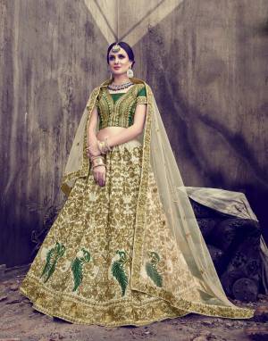 This Wedding Season Catch All The Lime Light Wearing This Heavy Designer Lehenga Choli In Dark Green Colored Blouse Paired With Pastel Green Colored Lehenga And Dupatta.  Its Blouse Is Fabricated On Art Silk Paired with Velvet Silk Lehenga And Net Dupatta. Its All Three Fabrics Ensures Superb Comfort all Day Long.