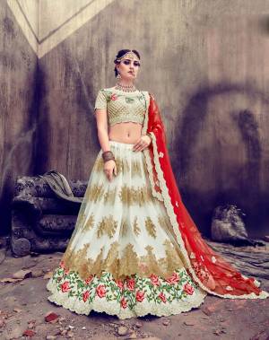 Here Is A Designer Lehenga Choli That Will Give Your Personality A Royal Look Like Never Before. Its Blouse Is Fabricated On Art Silk Paired With Net Lehenga And Net Dupatta. Its Blouse, Lehenga And Dupatta Are Fabricated On Net. Grab Everyones Attention Wearing This Lehenga Choli At The Next Wedding You Attend. 