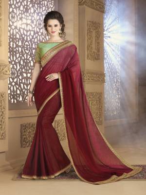 This Shaded Maroon Color Saree Is Paired With Contrasting Mint Green Colored Blouse. This Saree Is Fabricated On Georgette Paired With Art Silk Fabricated Blouse. It Has Attractive Embroidered Lace Border With Embroidered Blouse. Buy Now.