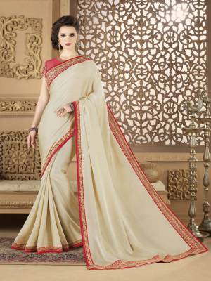 Flaunt Your Rich And Elegant Taste Wearing This Saree In Cream Color Paired With Red Colored Blouse. This Saree Is Fabricated Silk Georgette Paired With Net Fabricated Blouse. It Is Easy To Drape And Carry All Day Long.