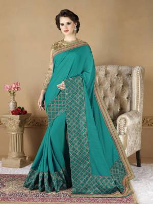 Grab This Saree In Turquoise Blue Color Paired With Beige Colored Blouse. This Saree Is Fabricated On Art Silk Paired With Net Fabricated Blouse. Its Attractive Color And Embroidery Will Earn You Lots Of Compliments From Onlookers.