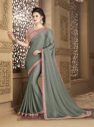 Here Is A Beautiful Saree That You Can Not Resist To Wear It Again And Again. Grab This Elegant Looking Saree In Grey Color Paired With Baby Pink Colored Blouse. This Saree Is Fabricated On Chiffon Paired With Net Fabricated Blouse. Both Its Fabrics Are Light Weight And Easy To Carry All Day Long.