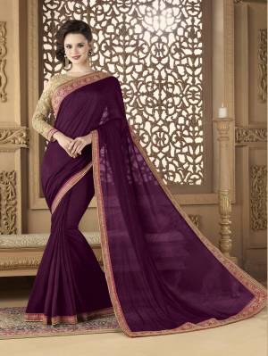 Add This Lovely Shade To Your Wardrobe With This Saree In Wine Color Paired With Beige Colored Blouse. This Saree Is Fabricated On Art Silk Paired With Net Fabricated Blouse. It Has Heavy Embroidery All Over The Blouse And Lace Border.