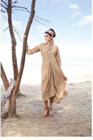 Flaunt Your Rich And Elegant Taste Wearing This Kurti In Beige Color Fabricated On Rayon Cotton With Beautiful Drape Pattern. It Is Soft Towards Skin and Its Pattern Is Comfortable To Carry All Day Long.