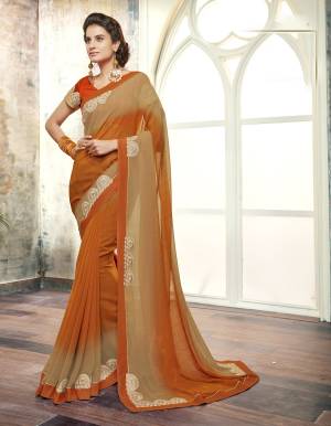 New Shade Is Here With This Saree In Rust Orange And Beige Color Paired With Orange Colored Blouse. This Saree Is Fabricated On Georgette Paired With Art Silk Fabricated Blouse. It Is Light Weight And Easy To Carry All Day Long.