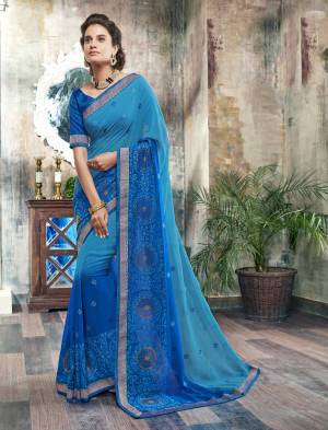 Look Beautiful Wearing This Saree In Blue Color Paired With Blue Colored Blouse. This Saree Is Fabricated On Chiffon Paired With Art Silk Fabricated Blouse. It Has Tone To Tone Resham Embroidery Making The Saree Attractive. Buy Now.