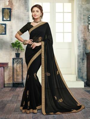 Enhance Your Beauty wearing This Saree In Black Color Paired With Black Colored Blouse. This Saree Is Fabricated On Georgette Paired With Art Silk Fabricated Blouse. It Is Beautified With Stone Work And Lace Border. Buy Now.