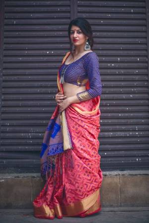 Look Pretty In this Pink Colored Saree Paired With Contrasting Navy Blue Colored Blouse. This Saree And Blouse Are Fabricated On Jacquard Silk Beautified With Weave All Over It. Its Lovely Combination Will Earn You Lots Of Compliments From Onlookers.