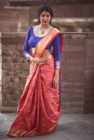 Most Demanding Color Os The Season Is Here With This Saree In Dark Peach Color Paired With Contrasting Blue Colored Blouse. This Saree And Blouse Are Fabricated On Jacquard Silk Beautified With Weave All Over It. 