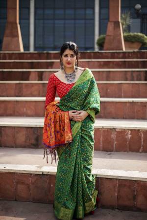 Here Is A Proper Traditonal Colored Saree In Green Color Paired With Contrasting Red Colored Blouse. This Saree And Blouse Are Fabricated On Jacquard Silk Beautifid With Weave. Buy this Saree Now.