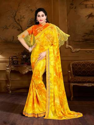 Attract All Wearing This Saree In Yellow Color Paired With Orange Colored Blouse And Yellow Colored Cape. This Saree Is Light In Weight And Easy To Carry All Day Long. Buy This Pretty Saree Now. This Designer Saree Will Earn You Lots Of Compliments From Onlookers.