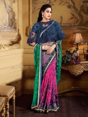 Here Is A Beautiful Colorful Saree In Pink And Green Color Paired With Navy Blue Colored Blouse And Cape. This Saree Is Fabricated On Georgette Brasso PairedWith Crepe Blouse And Net Fabricated Cape. Buy This Saree Now.
