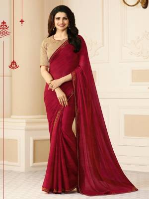 Adorn The Royal Look Wearing This Designer Elegant Saree In Maroon Color Paired With Beige Colored Blouse. This Saree Is Fabricated On Georgette Paired With Art Silk Fabricated Blouse. It Is Beautified With Embroidered Blouse And Saree Lace Border Making The Saree More Rich And Elegant.